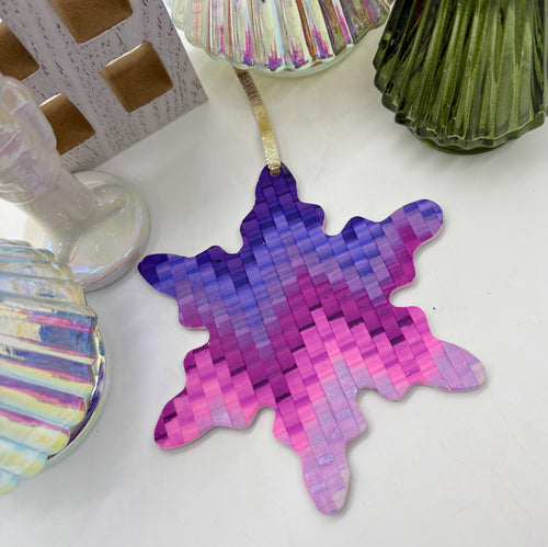 Snowflake ornament in purple pixel